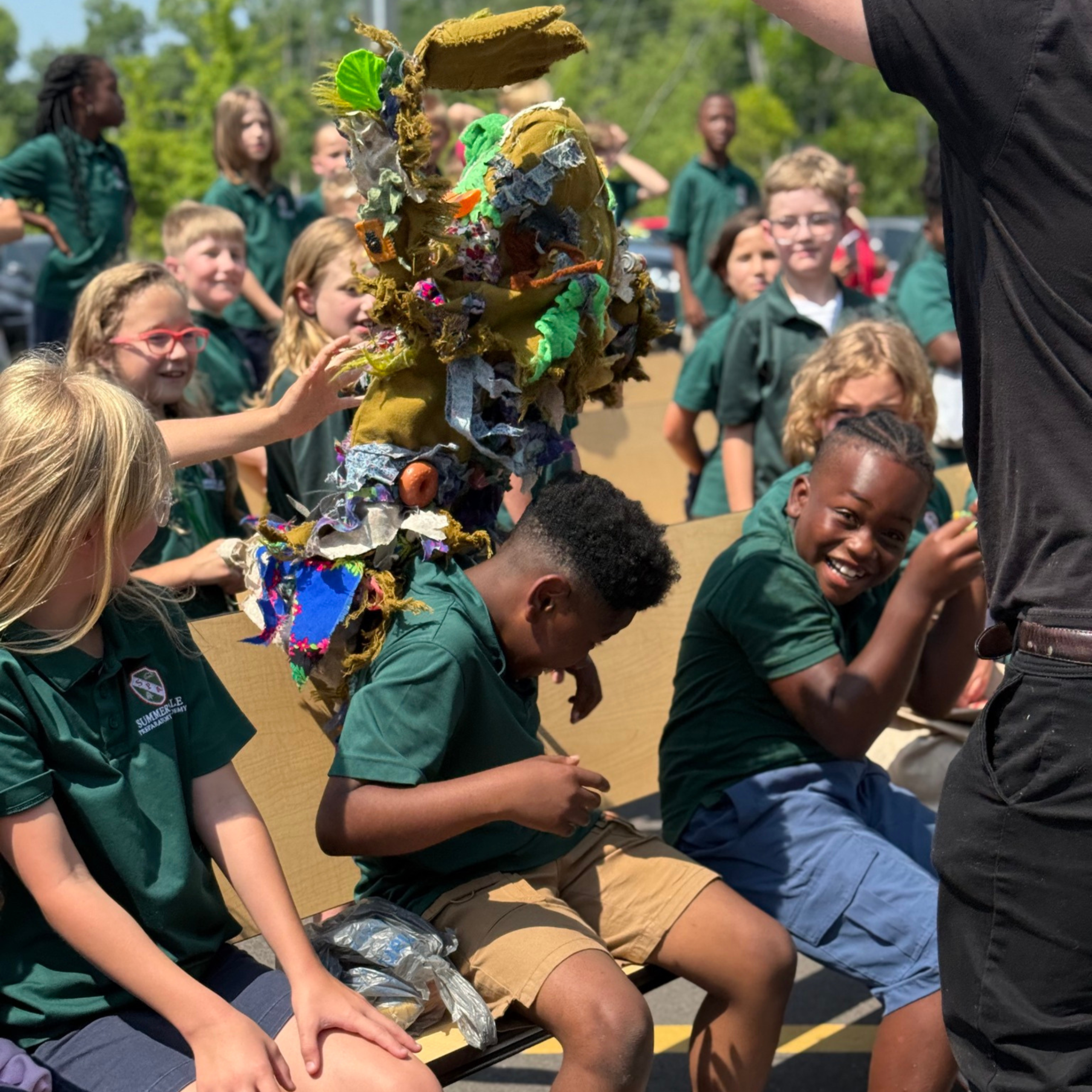 Group of school children as audience members of PalmettoPride's Litter Trashes Everyone Marionette Show.